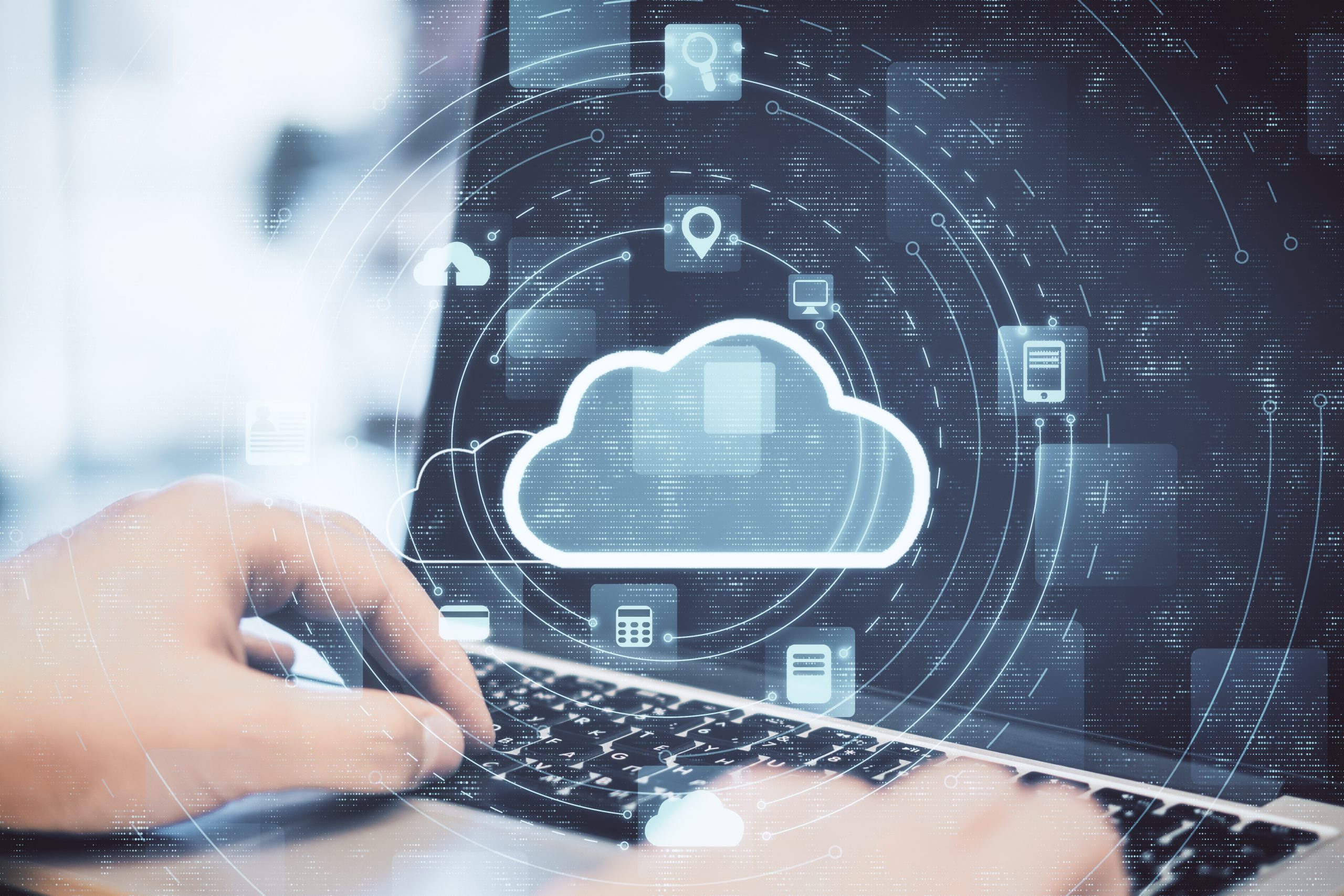 Hand using laptop with cloud computing diagram. Cloud computing and communication concept.